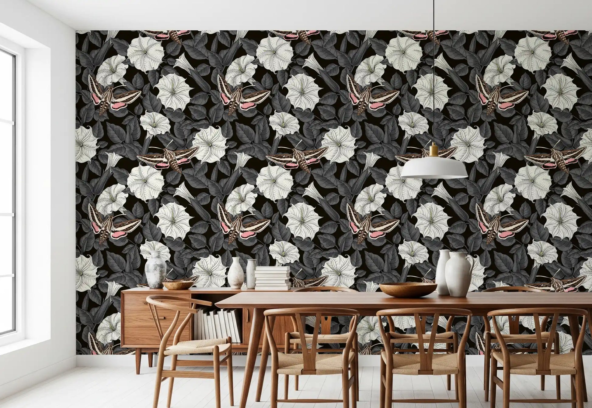 Dark foliage grounds the white blossoms in the Moonflowers and sphinx moths wallpaper.