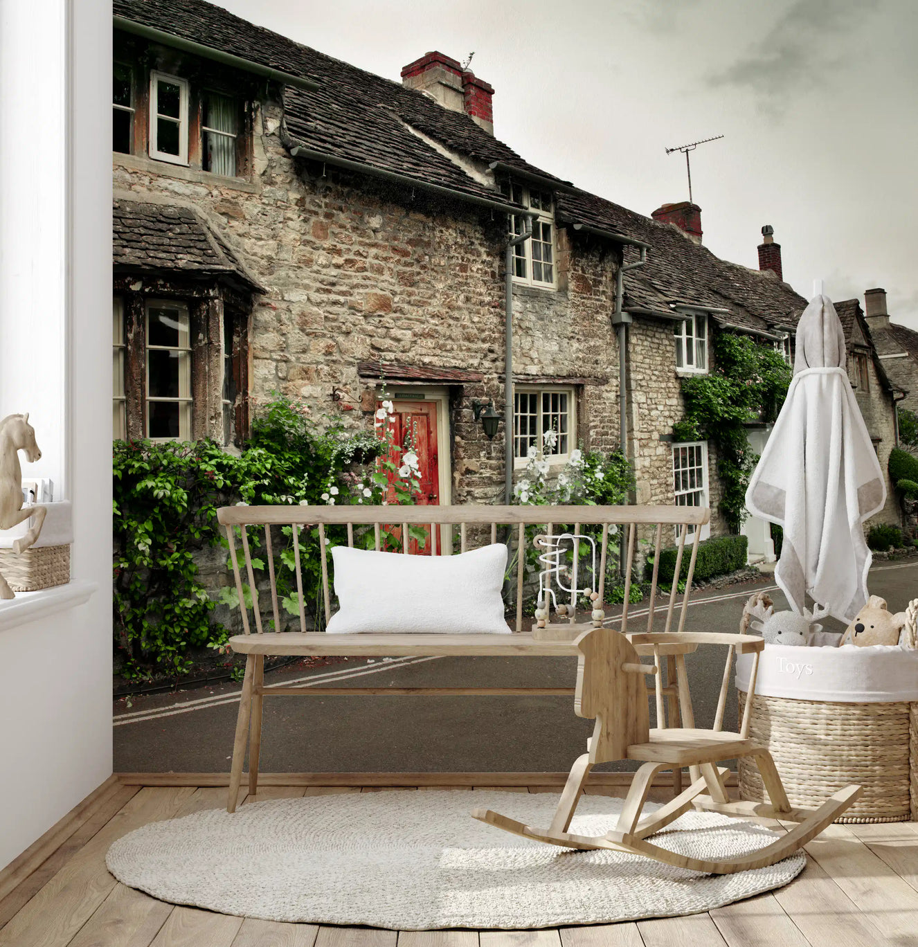 Sunlight fills a spacious Kids room the stone cottages village wall mural.
