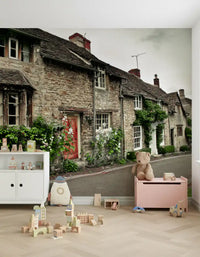 Playful building blocks rest against the kids room Timeless English Cottages wall mural.