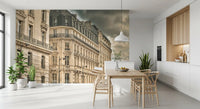 Limestone fronts and iron balconies curl around a corner inside this Dramatic Skies wall mural.