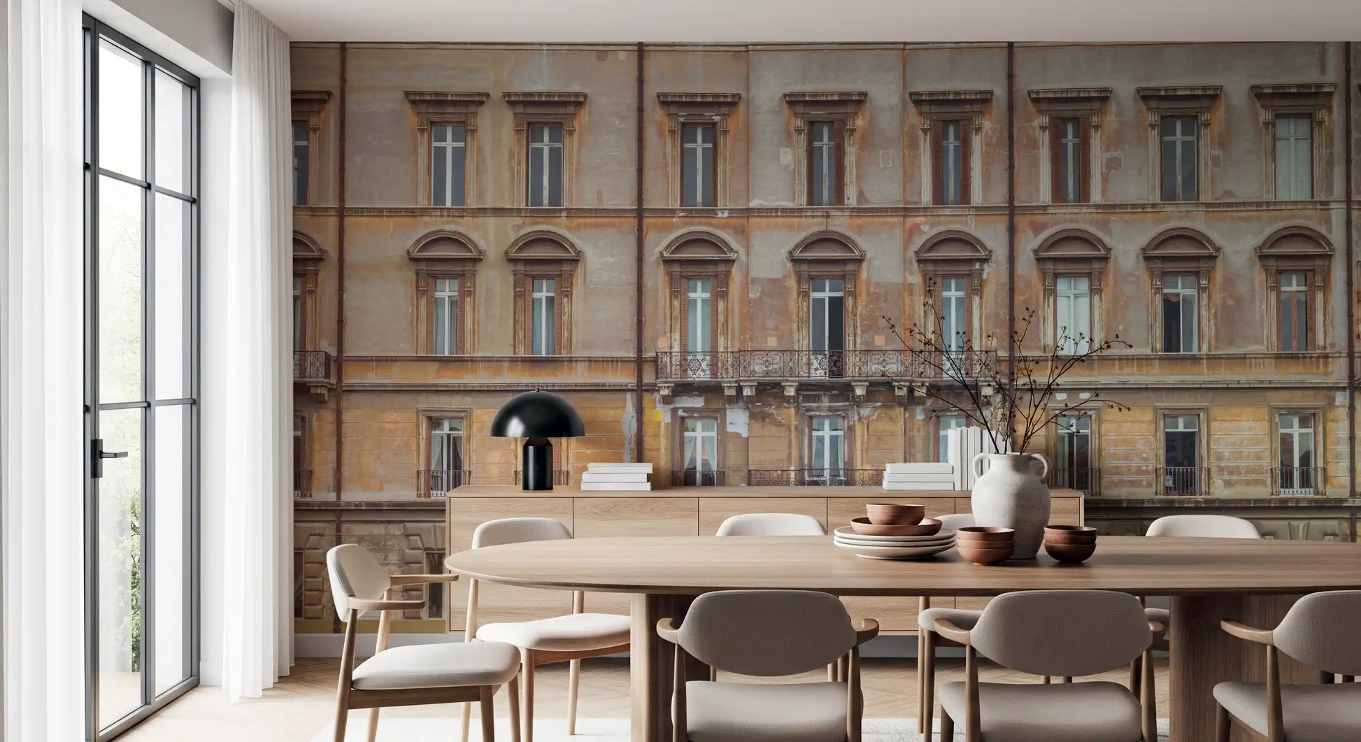 Sepia palazzo tones spread behind the dining room via a Grandeur Facade wall mural.
