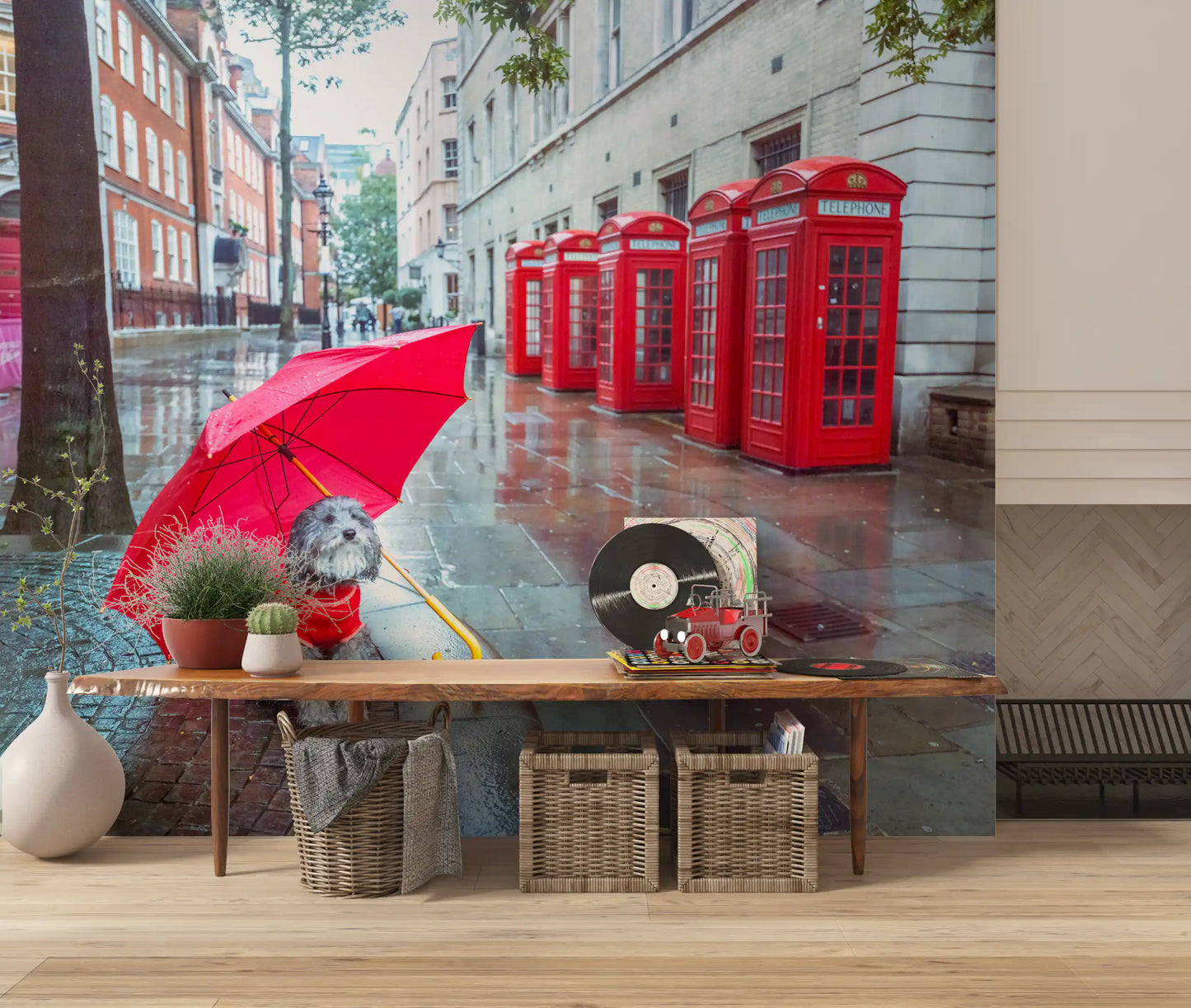 A scruffy terrier sits on wet paving holding a red umbrella in this Puddle Pal's Tale wall mural.