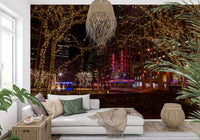 Deep red theatre signs sit at the centre of the Radio City Night Glow wall mural