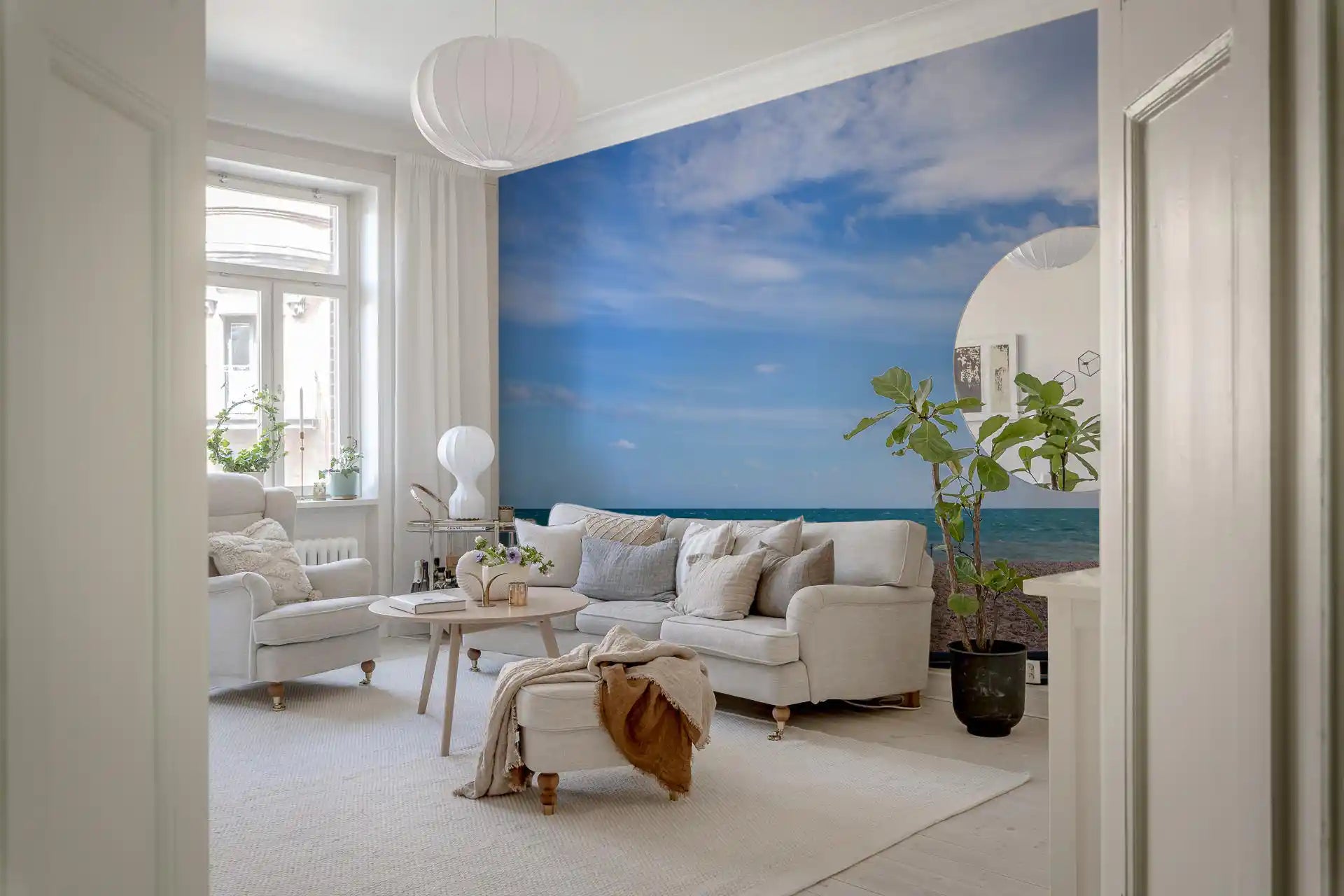 Bench silhouette against a wide sea within the Blue Escape wall mural piece