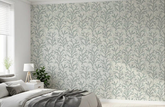Coral sprigs scatter calm above the bedroom in this Painted Coraline wallpaper piece.