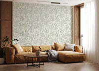 Sage, mist, moss, and ivory tones mingle inside this Painted Coraline wallpaper pattern.