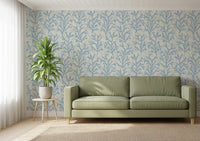 Indigo tones move through Painted Coraline Dreaming Blue wallpaper inside a calm lounge.