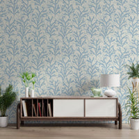 Pale blue brushstrokes of Painted Coraline Blue wallpaper line a clean hallway.