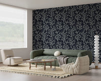 This Living room branching Coraline wallpaper behind the sleeping area.