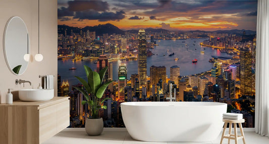 Minimalist bathroom fixtures sit beneath the vibrant Hong Kong Twilight Skyline Wall Mural.