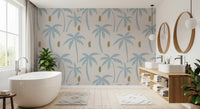 Bathroom with pale blue palm tree wallpaper creating a breezy tropical coastal backdrop