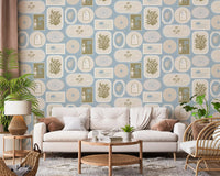 Living room with Soft Blue Coastal wallpaper and tropical framed scenes