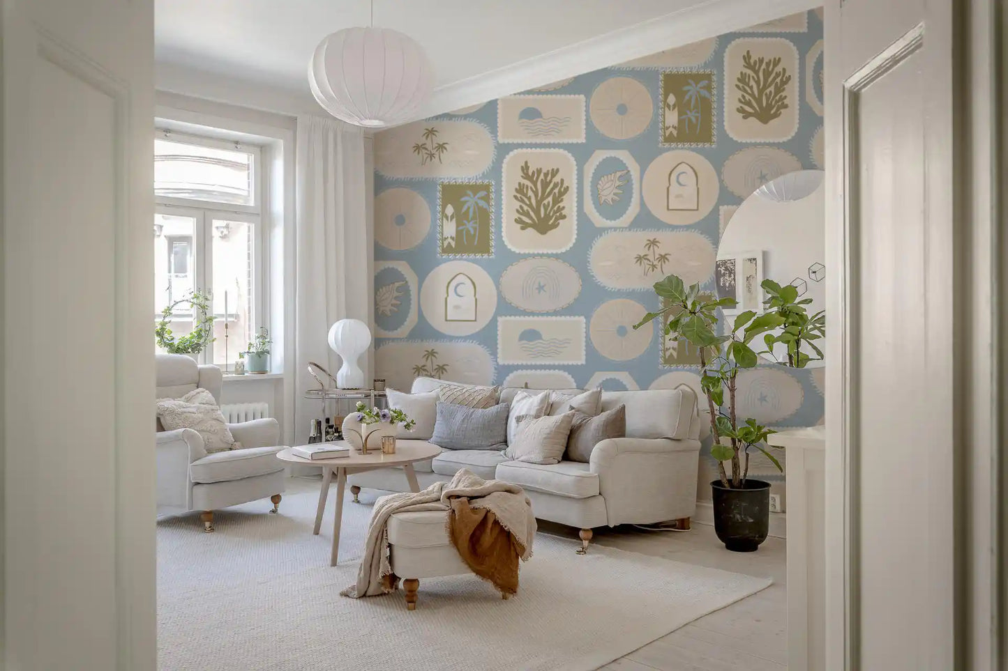 Hallway with Soft Blue Wallpaper and framed ocean-inspired patterns