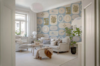 Hallway with Soft Blue Wallpaper and framed ocean-inspired patterns
