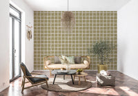 Beige grid wallpaper with olive tone, open spacing, and handmade pattern feel
