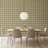 Dining room wallpaper showing green grid pattern with warm neutral square spacing