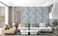 Coastal leaf wallpaper with white tropical silhouettes and airy blue detail