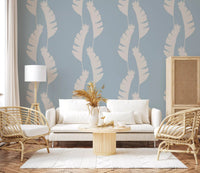 Living room wall using Boho Coastal Wallpaper with pale blue leaf silhouettes