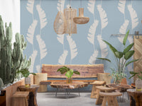 Boho Coastal Wallpaper showing oversized white leaves on a pale blue surface