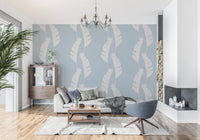 Hallway wallpaper with white banana leaf shapes on a muted blue background