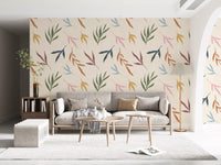Painted foliage wallpaper with abstract leaves and warm pastel accents