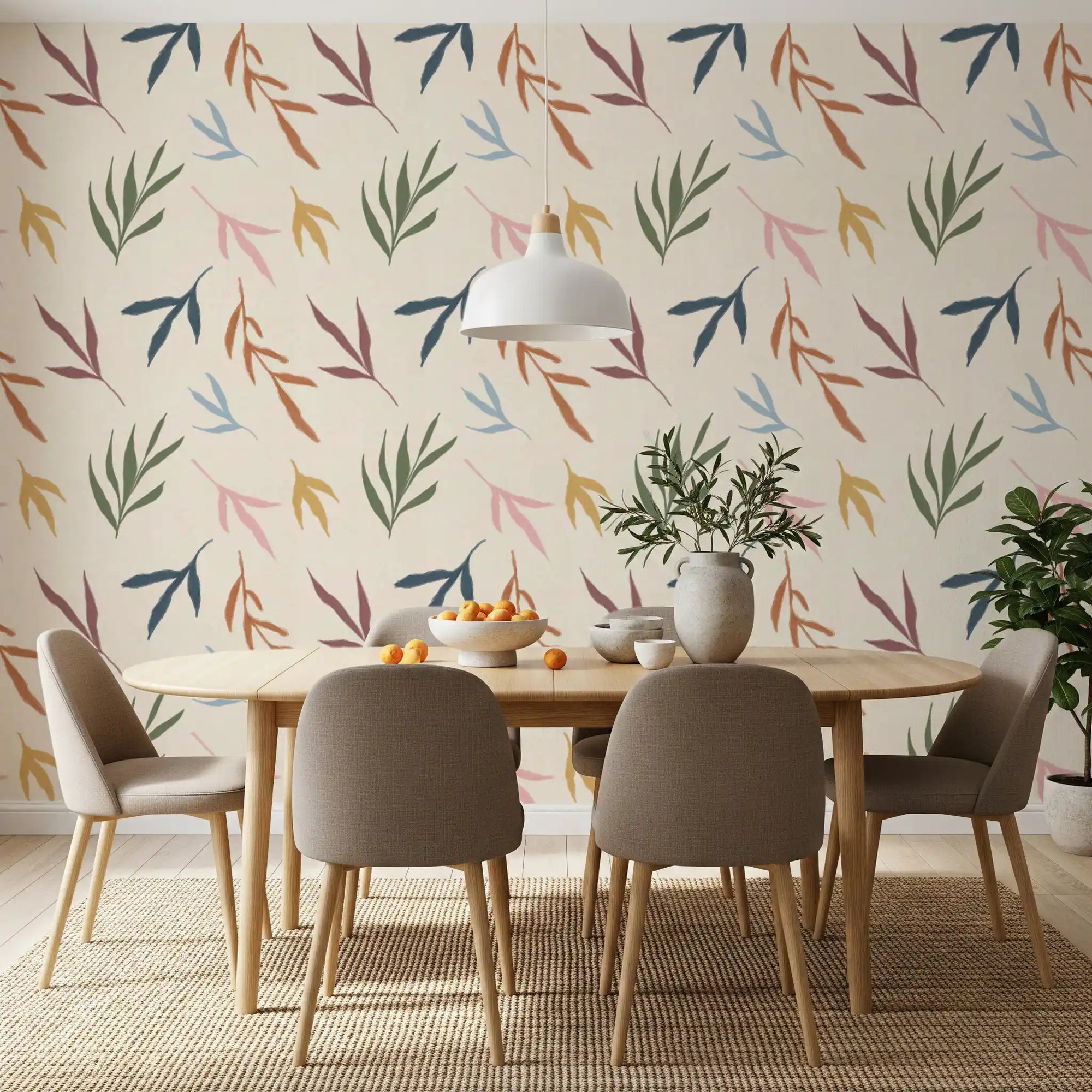 Dining room with Tropical Painted Leaves wallpaper and soft pastel foliage