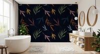Bathroom wallpaper with painted botanical shapes on a navy-black base