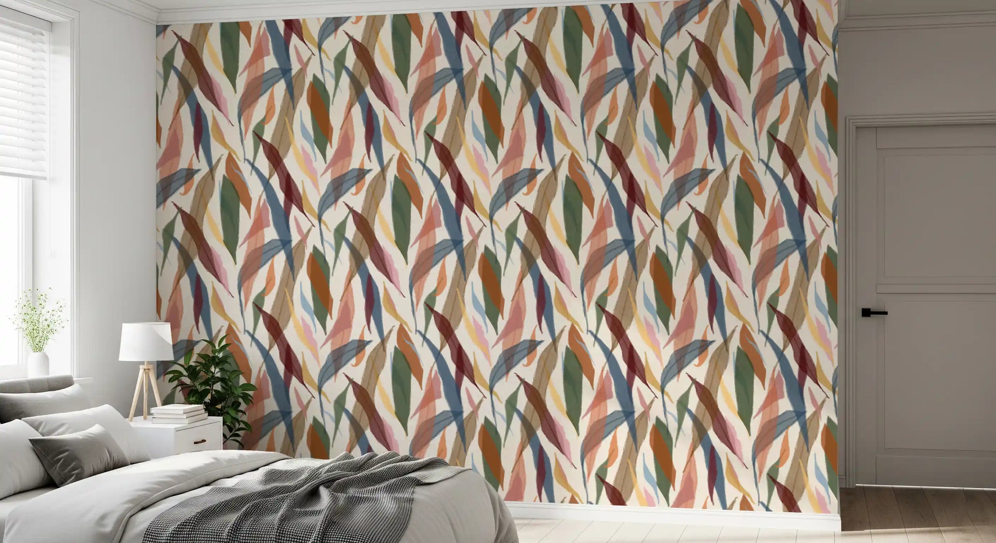 Bedroom wallpaper showing soft painted leaves on a light textured base