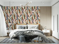 Artistic leaf wallpaper carrying ocher, blush, burgundy, and blue tones