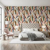 Bedroom wall using painted foliage wallpaper with muted tropical colour