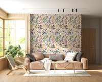 Living room with Tropical Wallpaper and painterly foliage on a light base