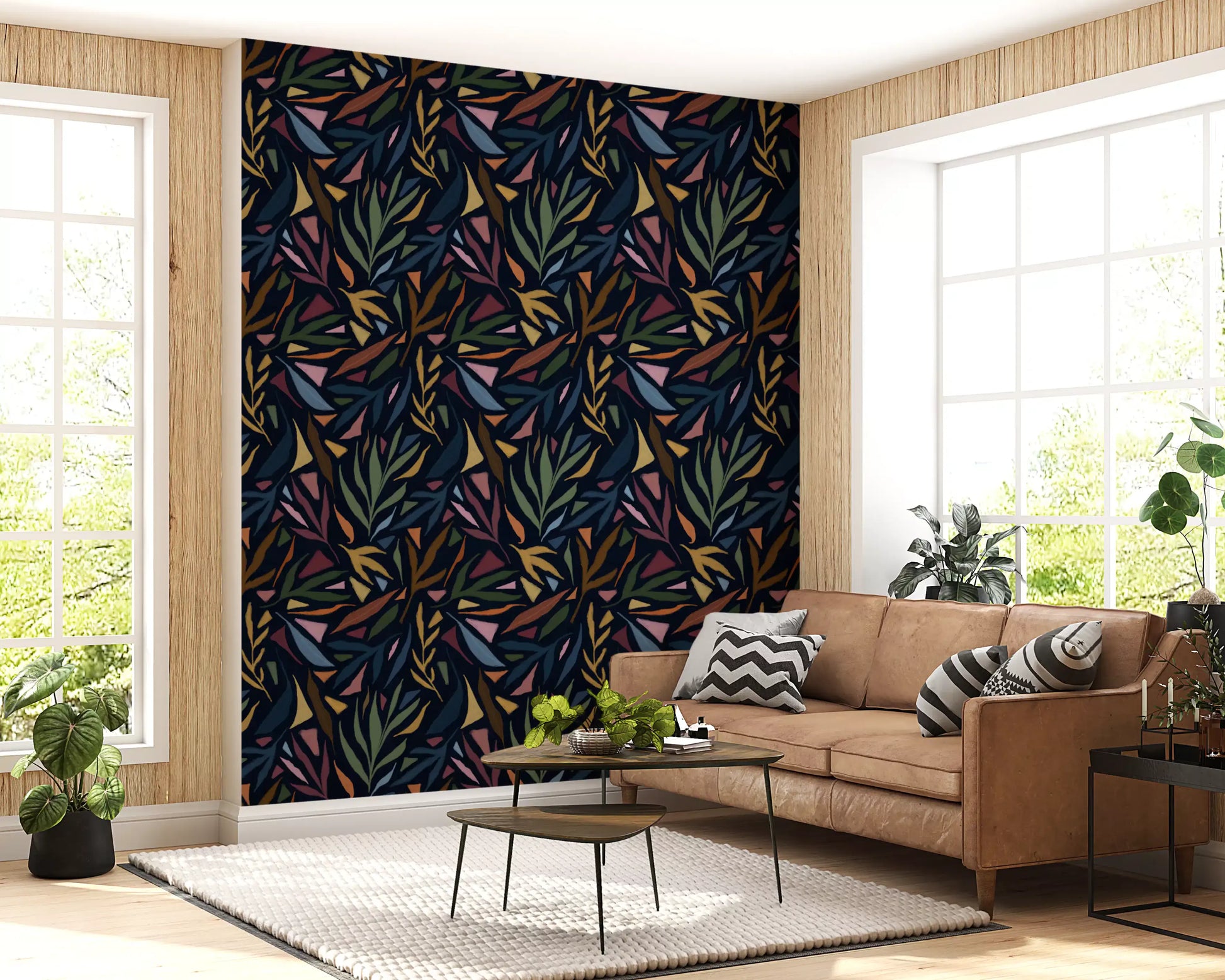 Living room wallpaper with Tropical Painted Collage leaf artwork on dark ground