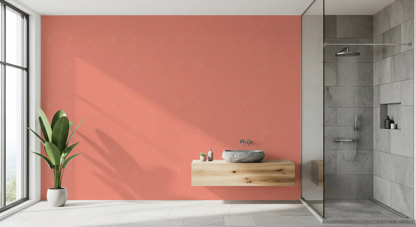 Bathroom featuring textured coral wallpaper with subtle surface grain