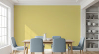 Dining room wall with linen texture wallpaper and soft yellow depth