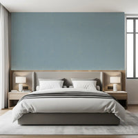 Vintage modern wallpaper in dusty blue with a restrained textured look