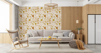 Decorative terrazzo wallpaper with sage accents and golden-brown detail