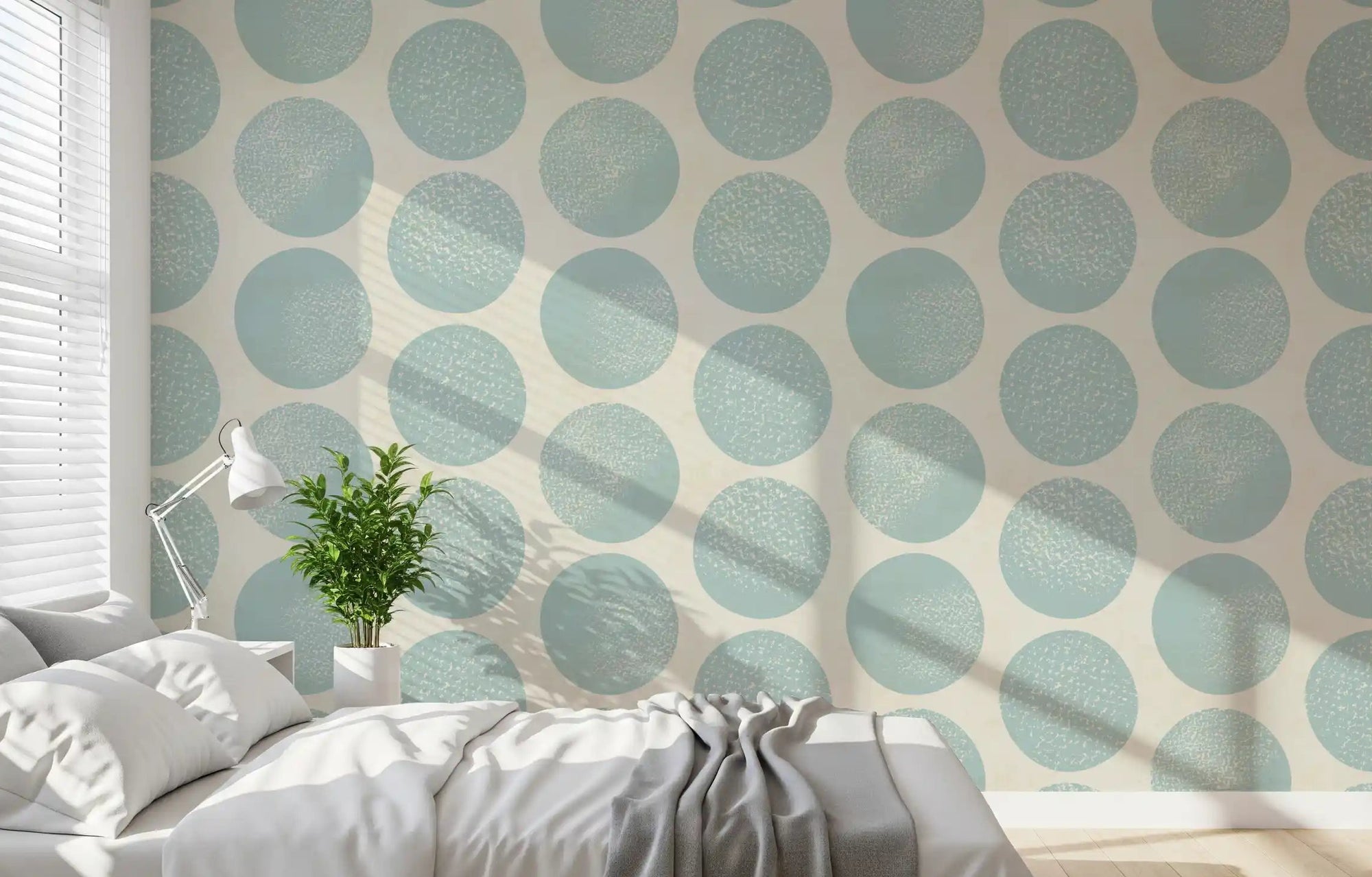 Bedroom featuring soft blue wallpaper with oversized round motifs