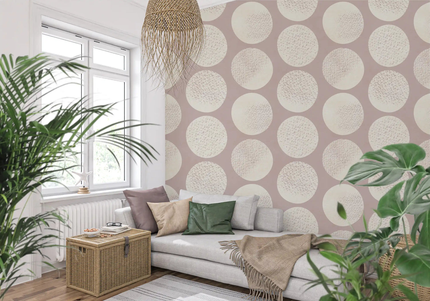 Cream round shapes sit across this blush wallpaper with gentle texture