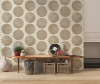 Organic polka dot wallpaper with large warm beige circles on cream