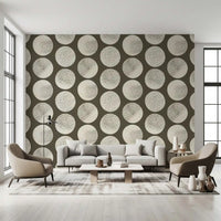 Brown and cream wallpaper showing circular forms with stippled texture