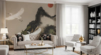 Watercolor landscape wall mural showing cranes across a beige sky backdrop