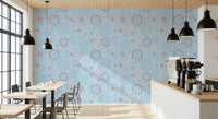 Light sky-blue base carries the motif in River wallpaper
