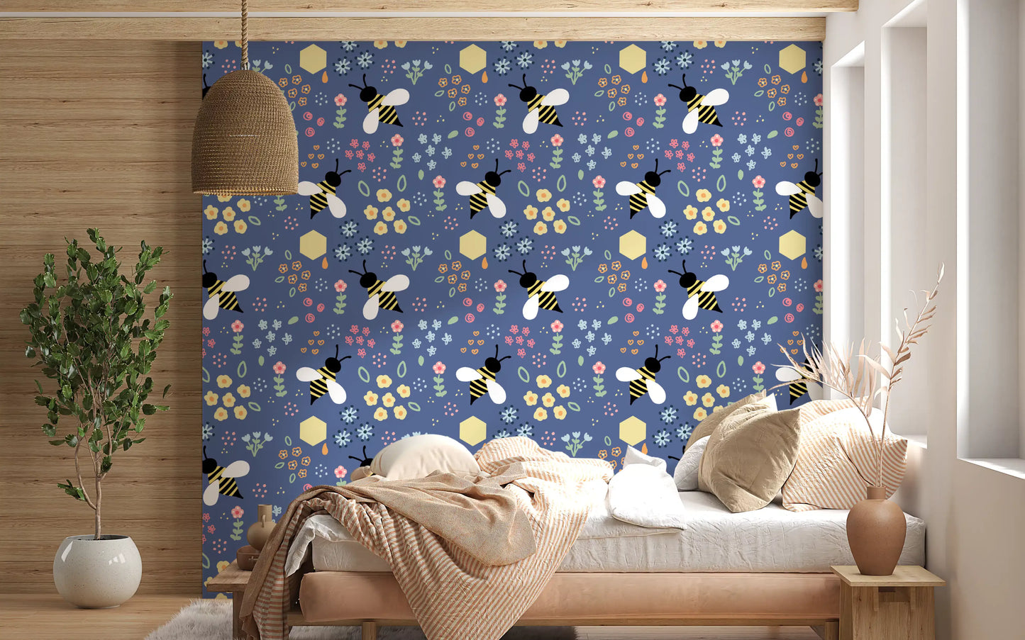 Bedroom feature spot wearing navy florals from the Bee Garden Wallpaper