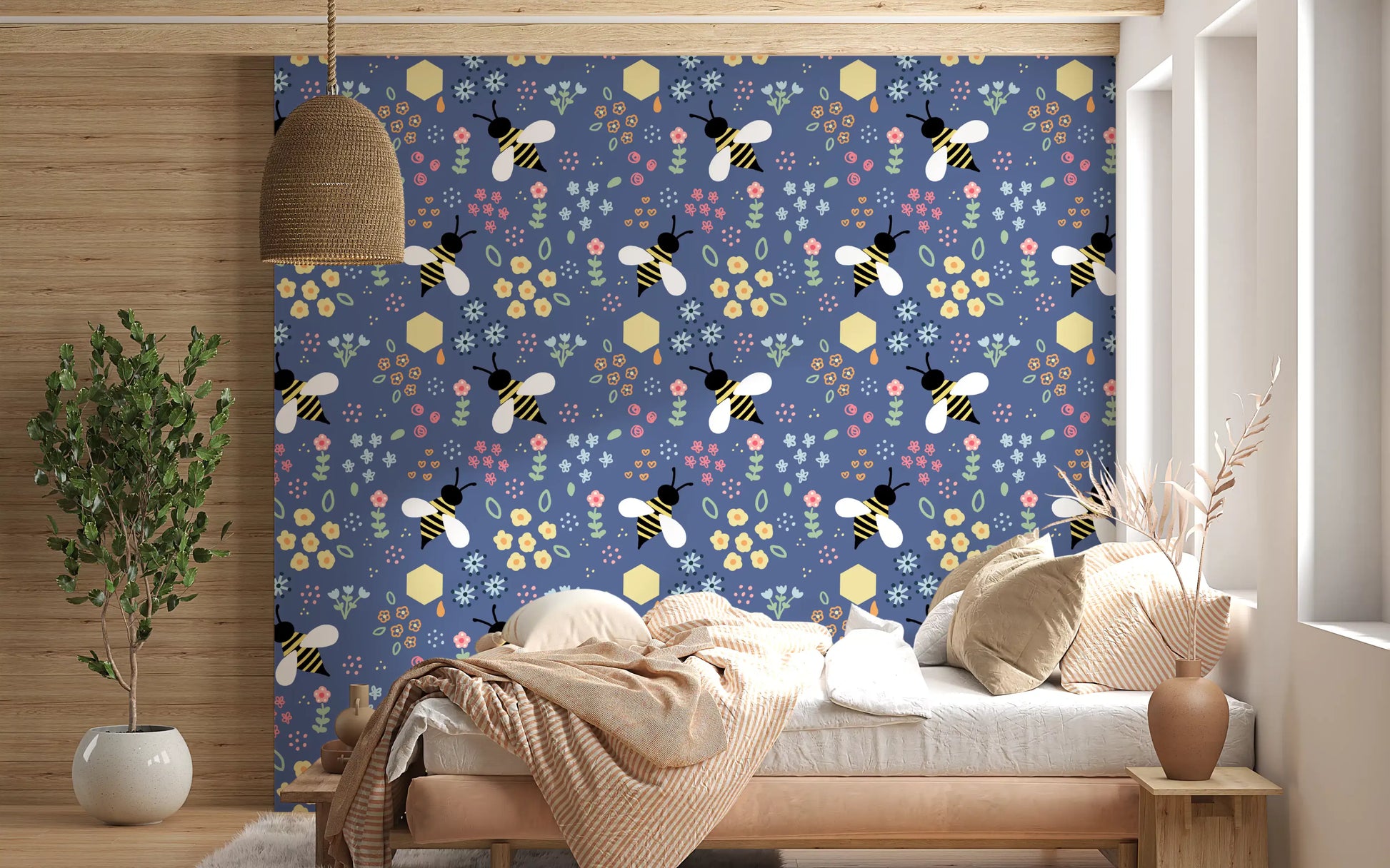 Bedroom feature spot wearing navy florals from the Bee Garden Wallpaper