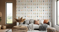Mustard, blush, and slate blooms repeat across the Wildflower Portraits wallpaper