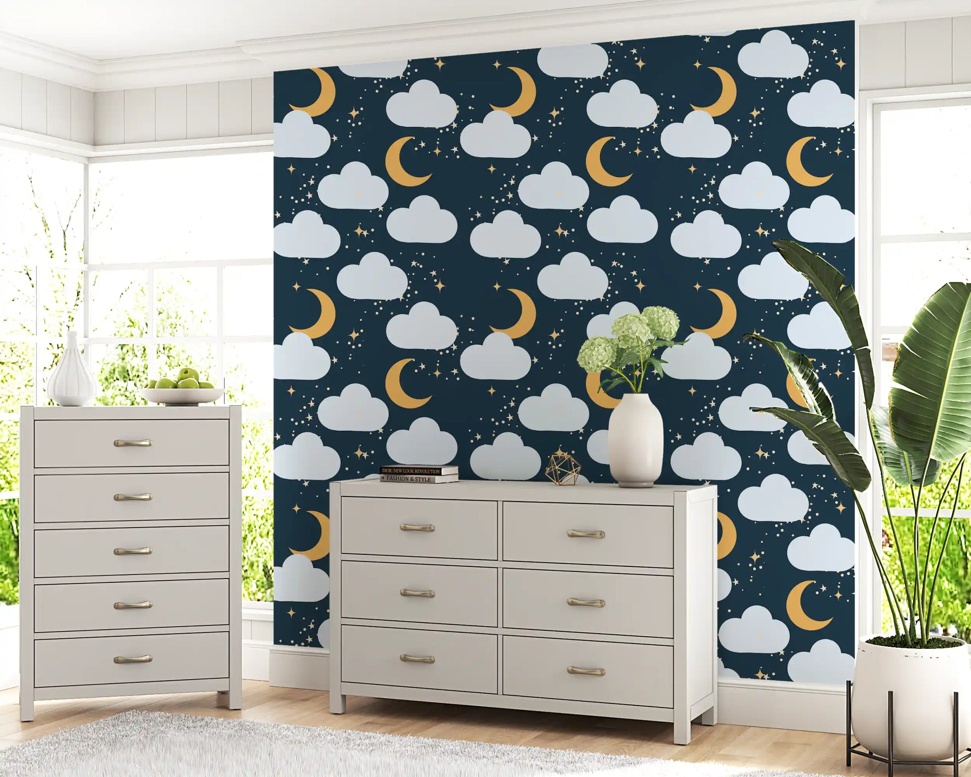 Pattern repeat of clouds, moons and sparkles on this navy wallpaper