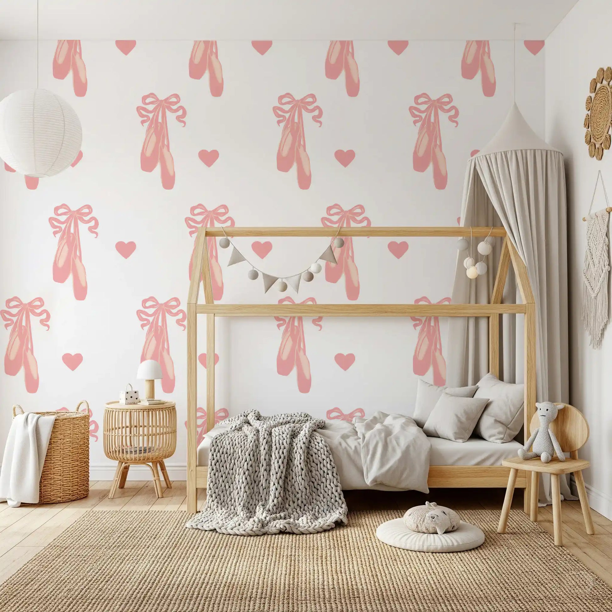 Kids' room gains a playful lift via Sweet Ballet wallpaper with bows and hearts.