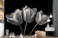 Nursery Play area  where pale tulip blooms spread a black wall mural