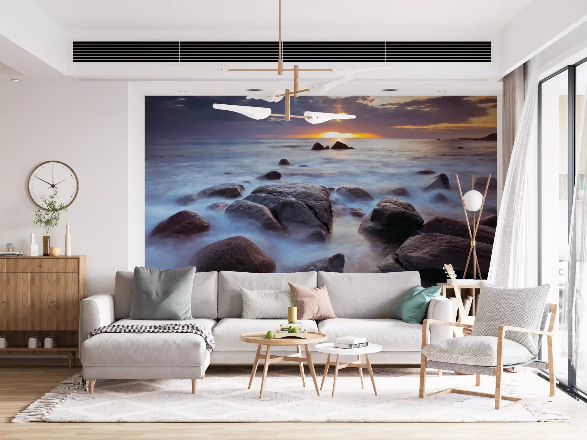 Warm shoreline glow fills this lounge through the Coastal Splendor wall mural