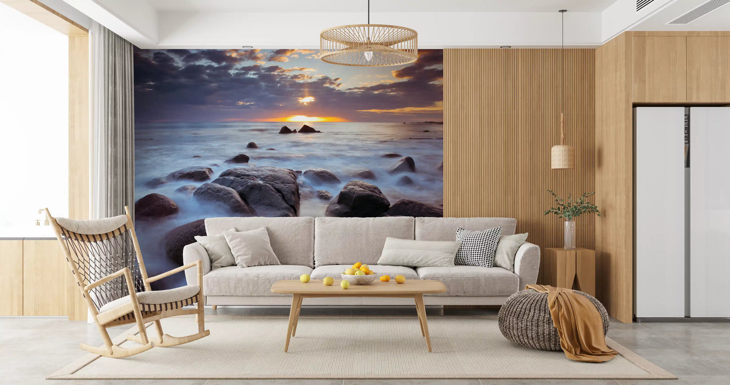 Living room paired with a misty rock and sea wall mural at sunset